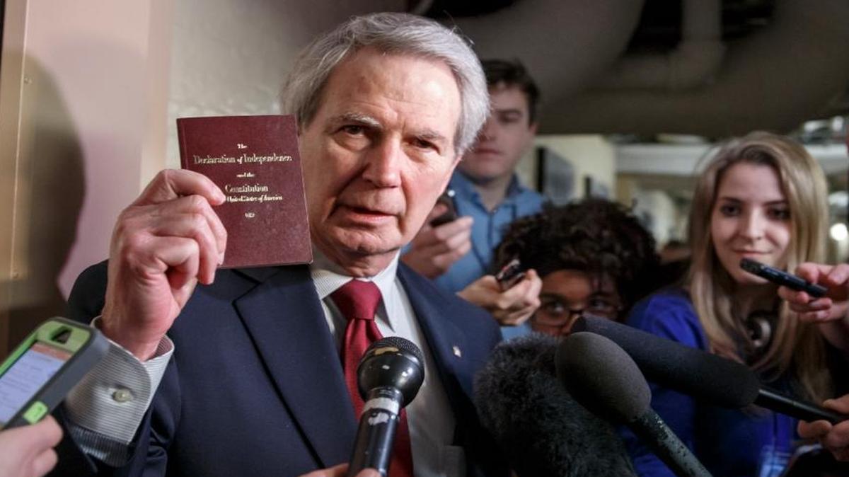Rep. Walter B. Jones, R-N.C., holds up a copy of the Constitution while talking to reporters as House Republicans emerge from a closed-door meeting on how to deal with the impasse over the Homeland Security budget, at the Capitol in Washington on Feb. 26, 2015.