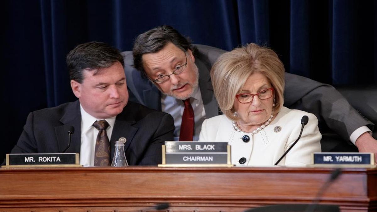 House Budget Committee Chair Diane Black, R-Tenn., right, joined at left by Rep. Todd Rokita, R-Ind., and panel staff member Jim Bates, center, works on the Republican health care bill, on Capitol Hill in Washington, Thursday, March, 16, 2017.