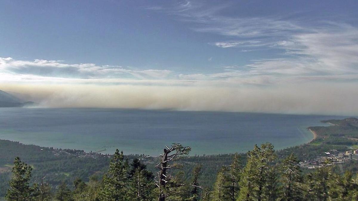 
This undated photo provided by the University of Nevada Reno, shows smoke from the King Fire in a view north across Lake Tahoe in South Lake Tahoe, Calif. 
