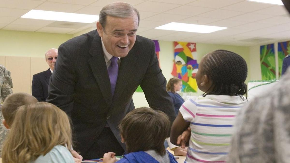 Former Rep. Jerry Costello, D-Ill., visited a child care center at Scott Air Force Base in May 2010. Since leaving Congress three years ago, Costello has made three times as much as his old salary as a lobbyist for companies, unions and trade groups.