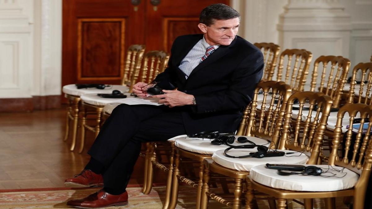Then-National Security Adviser Michael Flynn sits in the front row at a Feb. 10 news conference in the White House. Flynn was fired three days later and now faces a tangle of legal issues over his contacts with Russian officials.