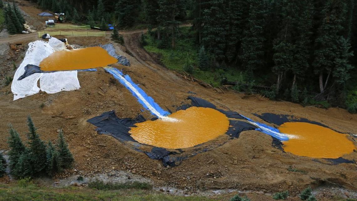 
Water flows through a series of retention ponds built to contain and filter out heavy metals and chemicals from the Gold King mine wastewater accident, in the spillway about 1/4 mile downstream from the mine, outside Silverton, Colo., Aug. 12, 2015. The EPA has taken full responsibility for the mine waste spoiling rivers downstream from Silverton, but people who live near the idled and leaking Gold King mine say local authorities and mining companies spent decades spurning federal cleanup help.
