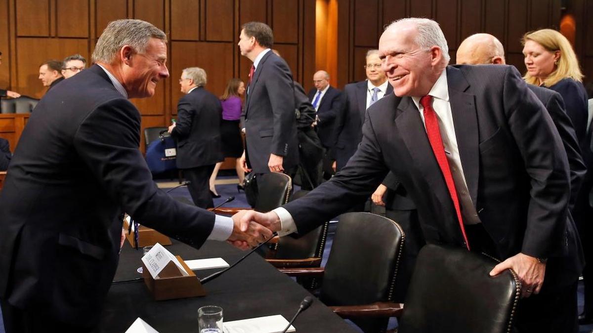 FILE – U.S. Senate Intelligence Committee Chairman Sen. Richard Burr, R-N.C., left, shakes hands with CIA Director John Brennan after a February 9, 2016 hearing in Washington, D.C. about worldwide terror threats. Burr and Brennan are both concerned about the “digital domain” exploited by Islamic State leaders.