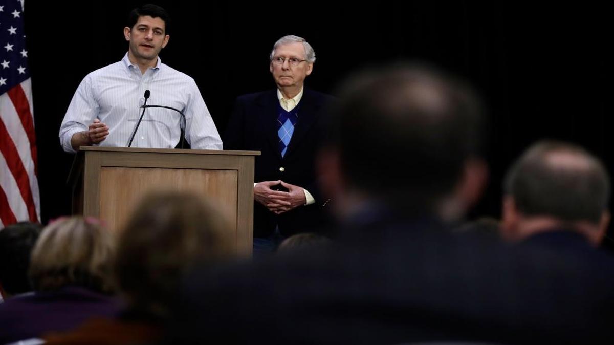 House Speaker Paul Ryan of Wisconsin, left, accompanied by Senate Majority Leader Mitch McConnell of Kentucky, speaks with reporters during a news conference at the Republican congressional retreat in Philadelphia.