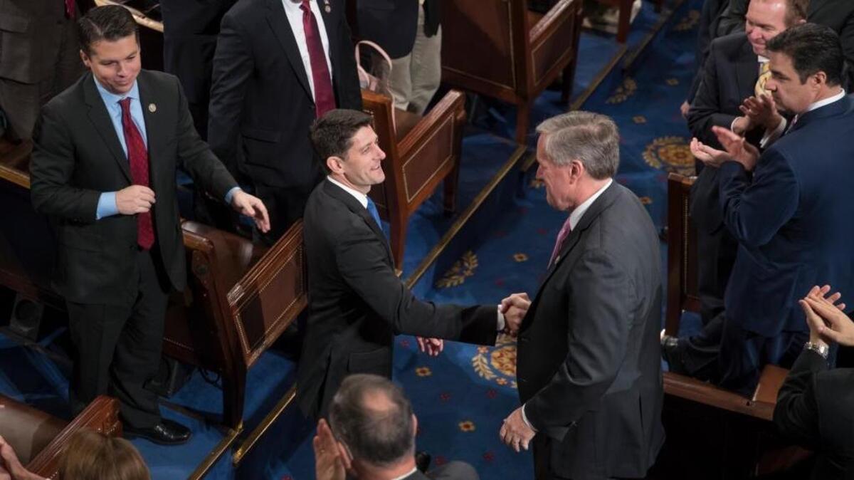 House Speaker Paul Ryan of Wis. shakes hands with Rep. Mark Meadows, R-N.C., right, as he is applauded following his re-election as speaker, during a ceremony in the House Chamber on Capitol Hill in Washington, Tuesday, Jan. 3, 2017.