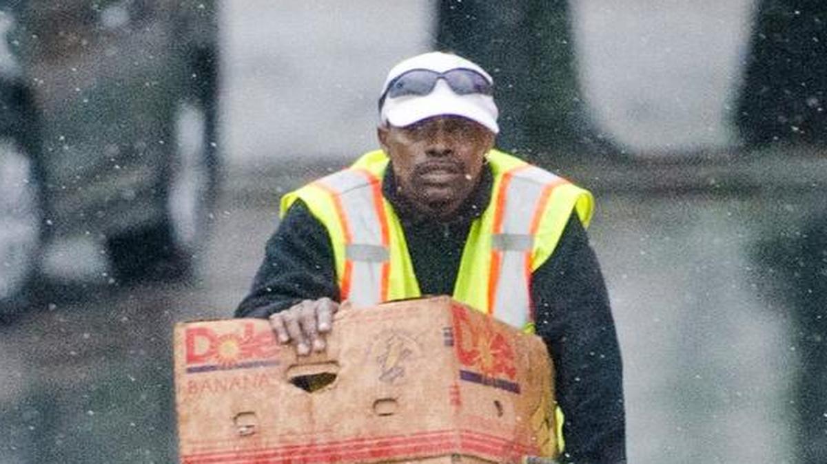 A man rides through the rain on 7th Street on Wednesday, April 5, 2017, in Charlotte, N.C. Severe storms, including the possibility for isolated tornadoes, were forecast for Charlotte and the surrounding areas.