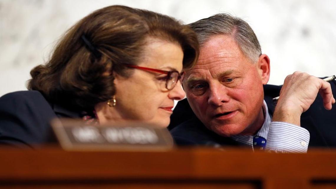In this Feb. 9, 2016, file photo, Senate Intelligence Committee Vice Chair Sen. Dianne Feinstein, D-Calif., talks with committee chairman Sen. Richard Burr, R-N.C., on Capitol Hill in Washington. A draft version of a Senate bill would effectively prohibit unbreakable encryption and require companies to help the government get access to readable data on a device if there’s a lawful search warrant. The draft is being finalized by Burr and Feinstein.