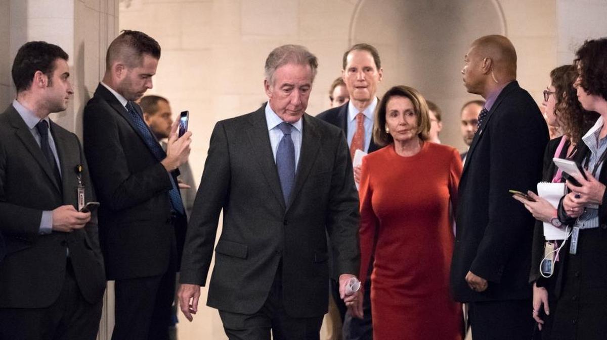 From left at center, Rep. Richard Neal, D-Mass., the ranking member of the House Ways and Means Committee, Sen. Ron Wyden, D-Ore., the ranking member of the Senate Finance Committee, and House Minority Leader Nancy Pelosi, D-Calif., arrive for a news conference to criticize the Republican tax reform being debated in Congress.