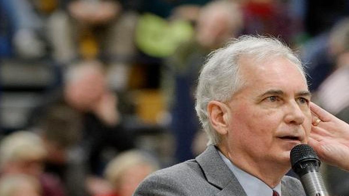 Republican Rep. Tom McClintock bends his ear to hear questions from a boisterous crowd during his town hall meeting at Oak Ridge High School in El Dorado Hills, Calif., on March 4, 2017.