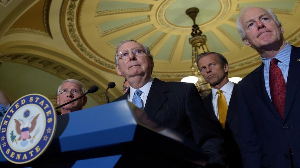Senate Majority Leader Mitch McConnell of Ky., second from left, standing with, from left, Sen. Roger Wicker, R-Miss., Sen. John Thune, R-S.D., and Senate Majority Whip John Cornyn, of Texas, listens to a question during a media availability on Capitol Hill in Washington, Tuesday, Sept. 13, 2016. The Senate may go into recess until the election if it can pass Zika funding and a continuing resolution this week.