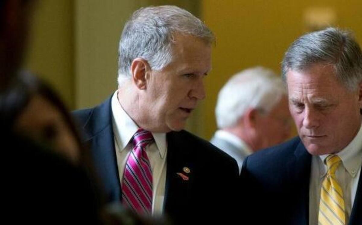 Sen. Thom Tillis, R-N.C., left, and Sen. Richard Burr, R-N.C., right, walk from a policy luncheon on Capitol Hill in Washington, July 8, 2015.