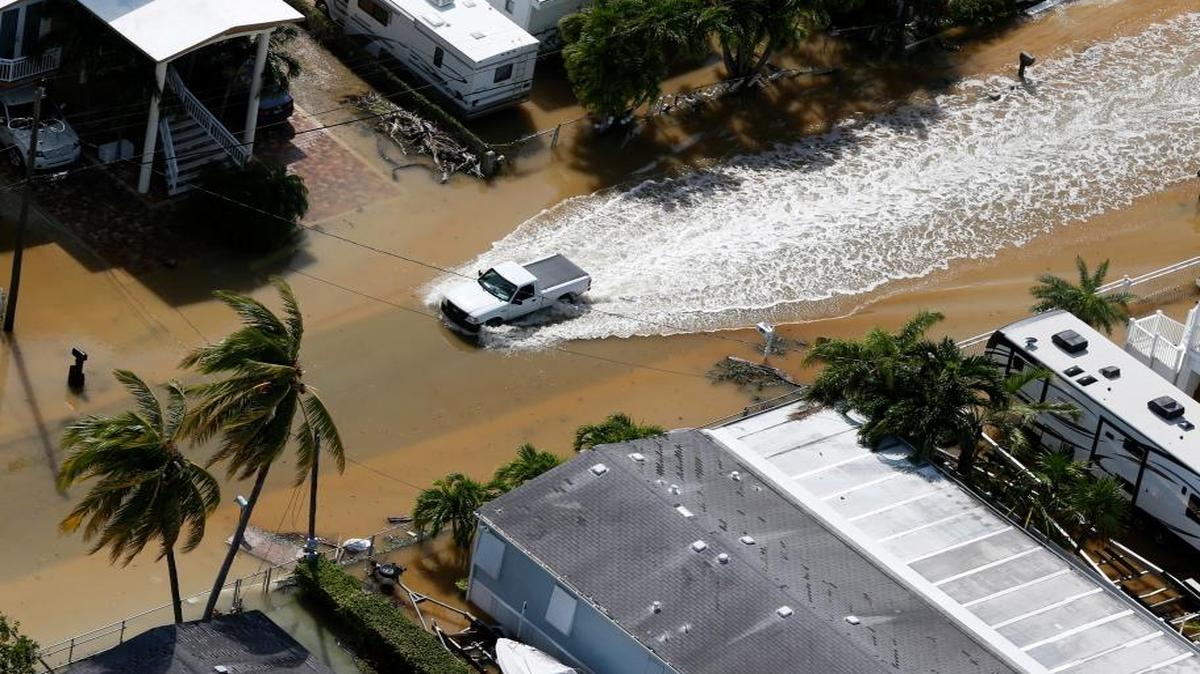 A truck drives through a flooded street in the aftermath of Hurricane Irma, Monday in Key Largo, Fla.