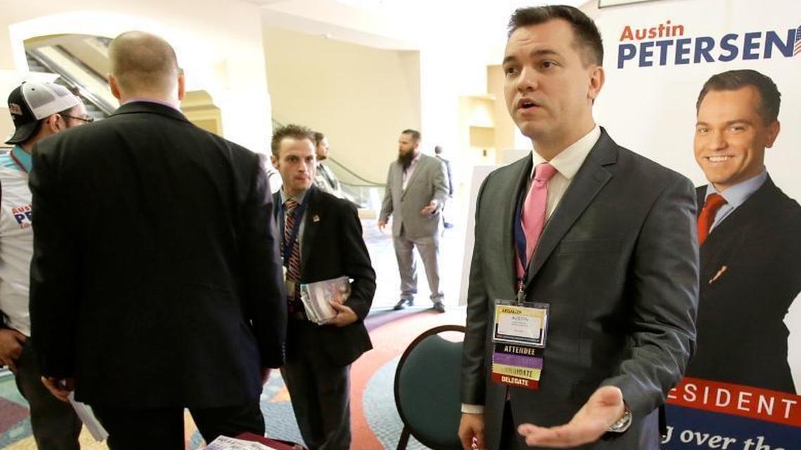 Libertarian presidential candidate Austin Petersen, center, speaks to delegates at the National Libertarian Party Convention last year.