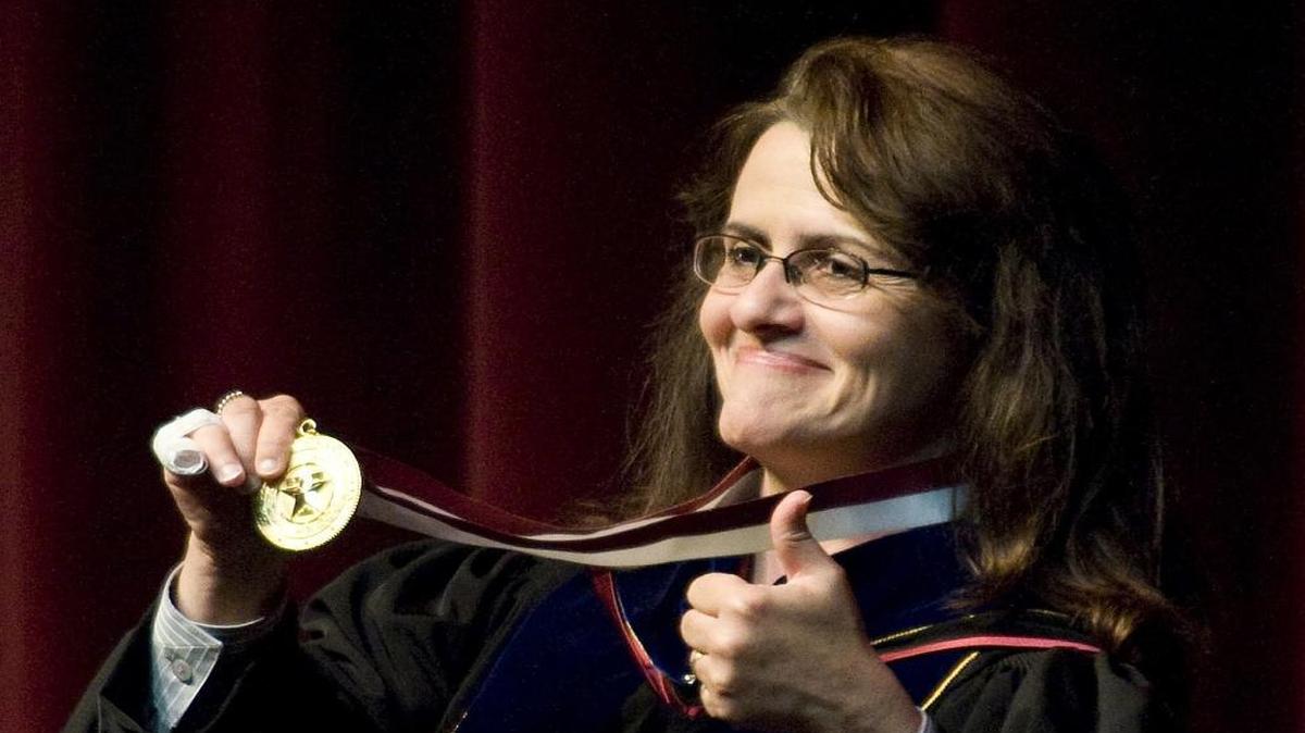 Former Texas A&M president Elsa Murano holds up a medallion after being formally named the university's 23rd president in 2008. Murano is one of three Texans who could become agriculture secretary under President-elect Donald Trump.