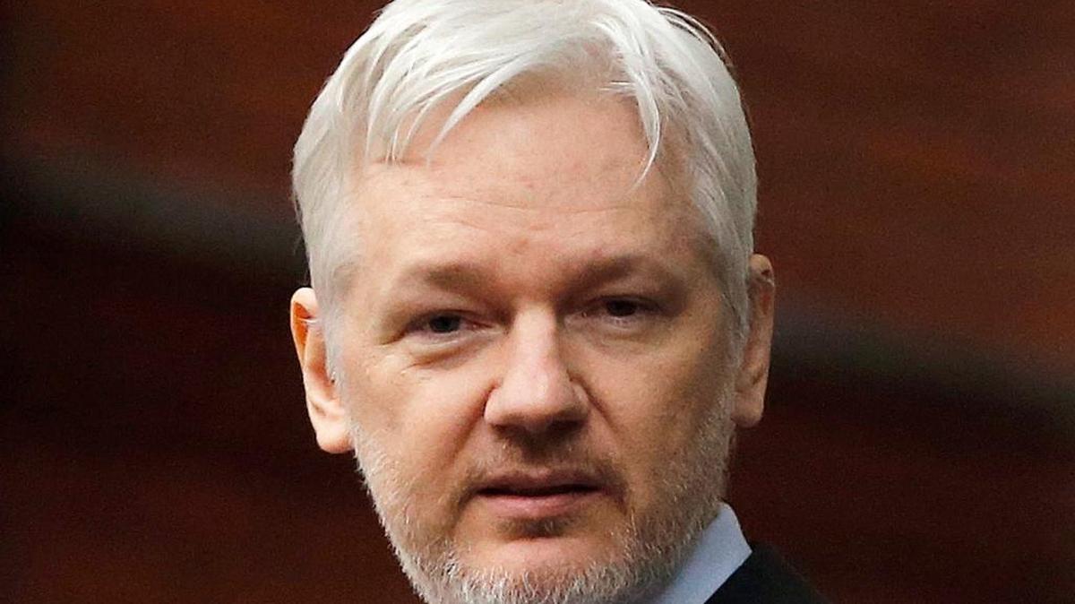 WikiLeaks founder Julian Assange stands on the balcony of the Ecuadorean Embassy in London.