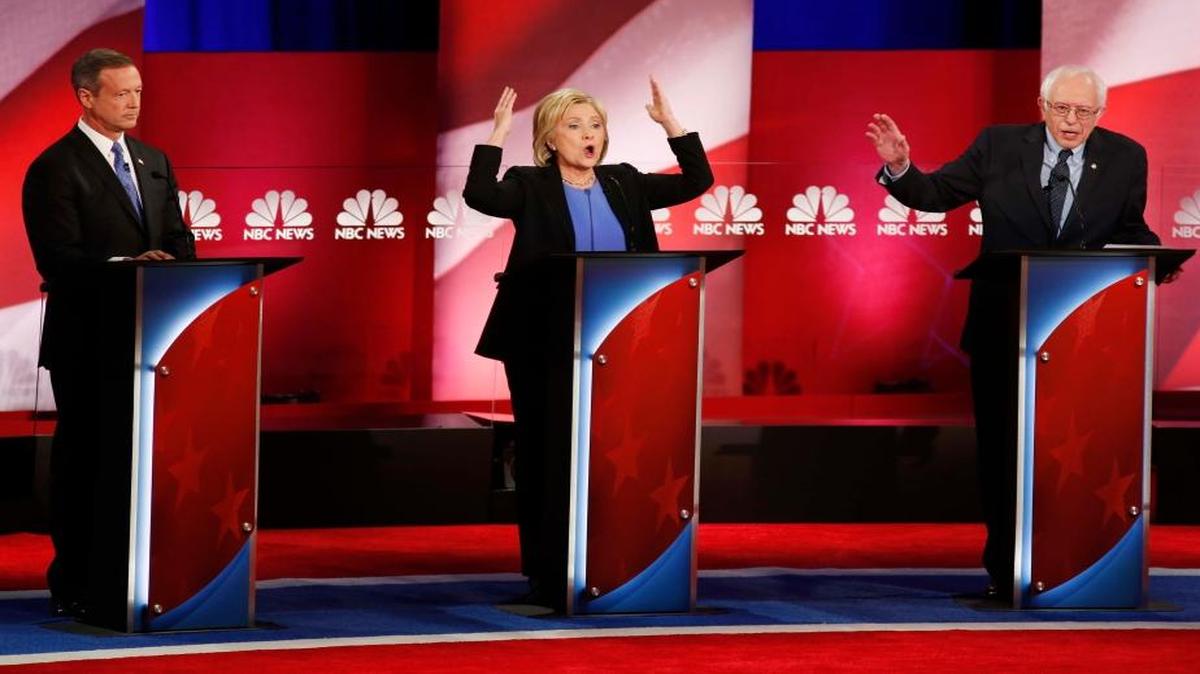 Sen. Bernie Sanders answers a question as Hillary Clinton gestures during the NBC-YouTube Democratic presidential debate at the Gaillard Center on Sunday, Jan. 17, 2016, in Charleston, S.C. Former Maryland Gov. Martin O’Malley is at left.