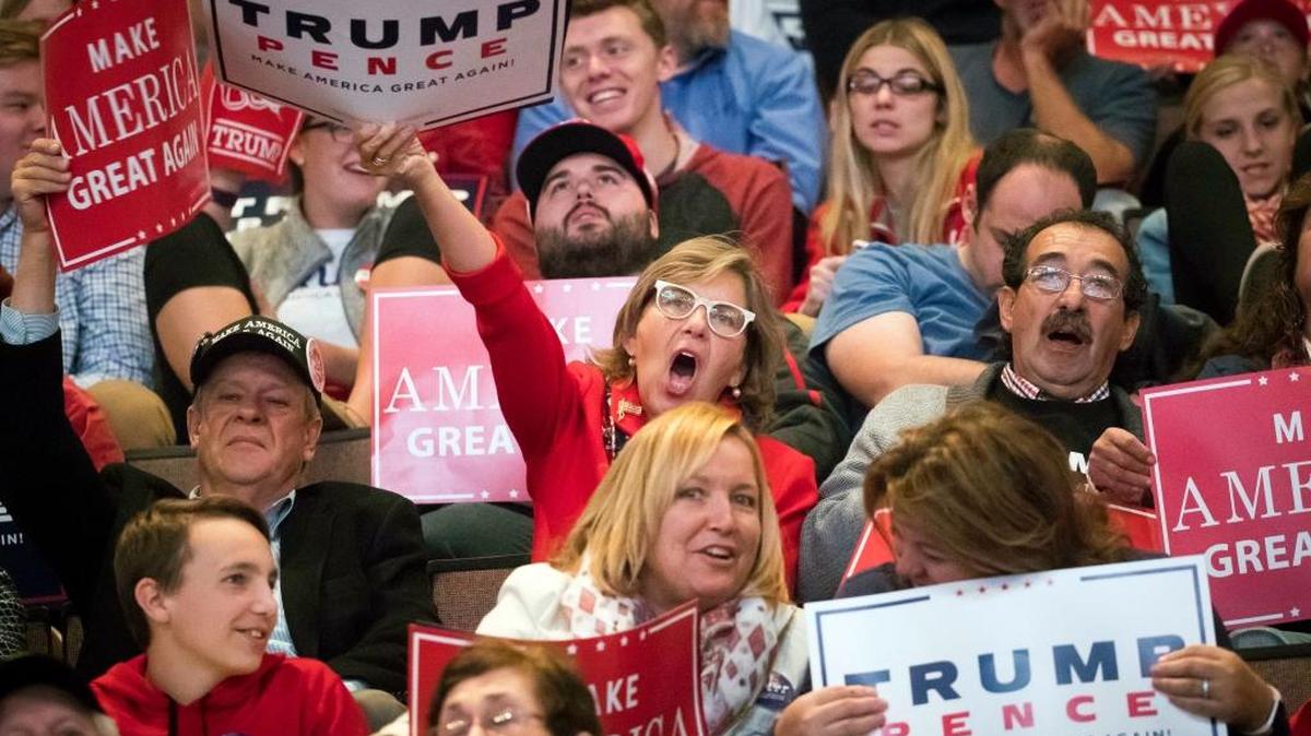 Supporters of Republican presidential candidate Donald Trump cheer during a campaign rally Thursday in Cincinnati.
