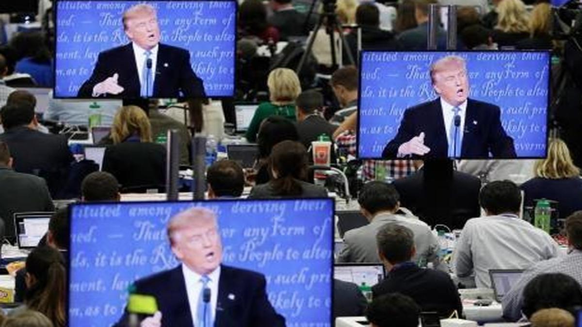 Republican presidential candidate Donald Trump is seen on screens in the media center during his presidential debate with Democratic presidential candidate Hillary Clinton at Hofstra University on Sept. 26, 2016, in Hempstead, N.Y.