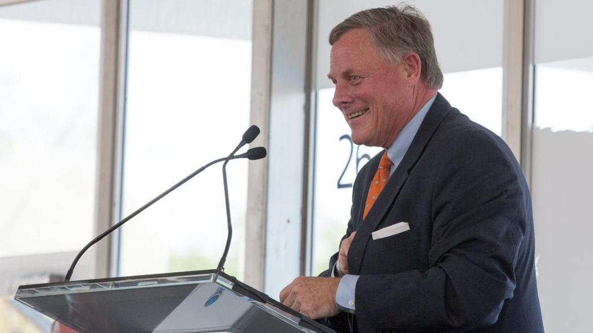 FILE – Sen. Richard Burr speaks during a Novo Nordisk groundbreaking ceremony Monday, March 28, 2016 in Clayton, N.C. Public opinion polling shows him with a single-digit lead over Democratic challenger Deborah Ross in North Carolina’s U.S. Senate race.