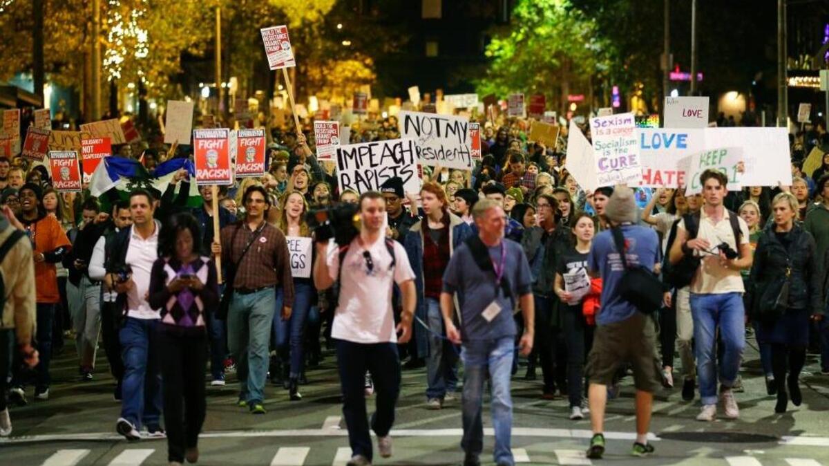 Hundreds of protesters march in downtown Seattle as they protest the election of President-elect Donald Trump, Wednesday, Nov. 9, 2016. A day after Trump’s election as president, the divisions he exposed only showed signs of widening as many thousands of protesters flooded streets across the country to condemn him.