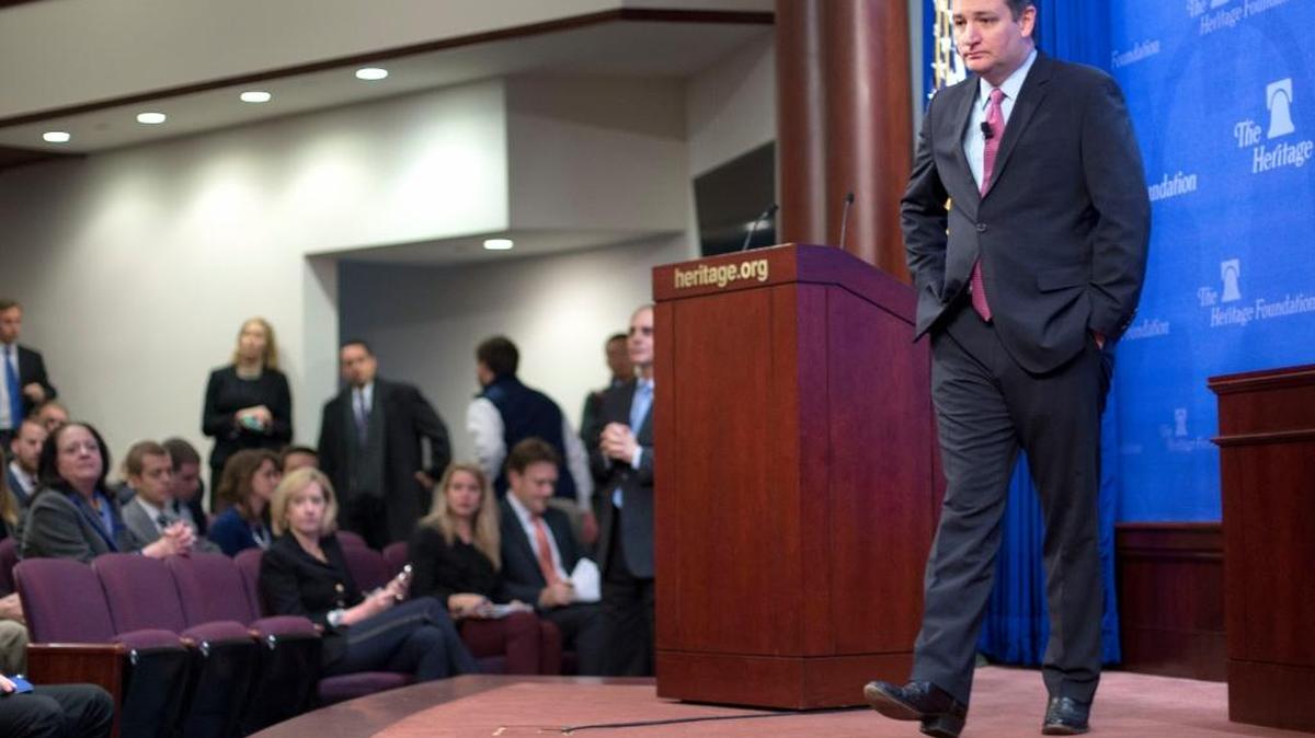 Republican presidential candidate Sen. Ted Cruz, R-Texas walks across the stage to answers question from members of audience at the Heritage Foundation in Washington, Thursday, Dec. 10, 2015.