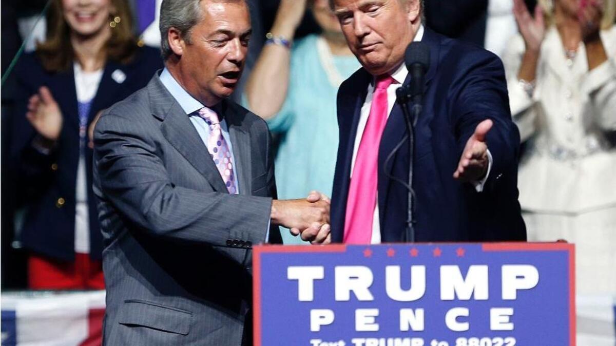 Pro-Brexit British politician Nigel Farage, left, joined then-candidate Donald Trump at a campaign rally in Jackson, Miss. in August.