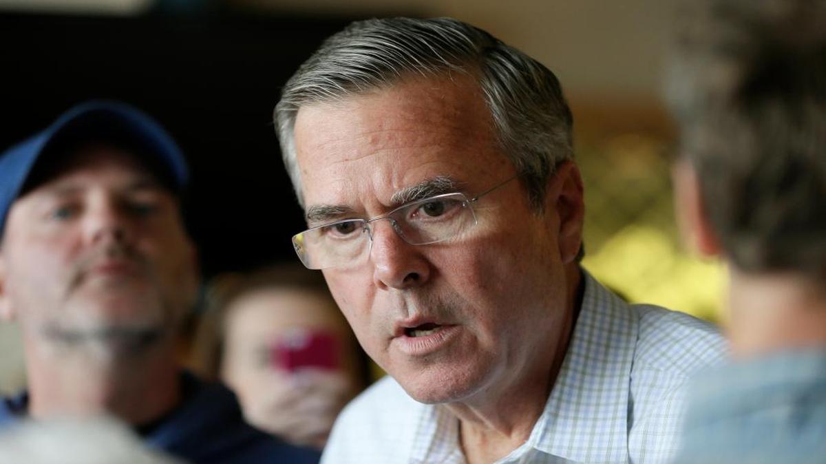 
Republican presidential candidate Jeb Bush greets local supporters at Gravy’s Diner on Tuesday, Sept. 22, 2015, in Cedar Falls, Iowa
