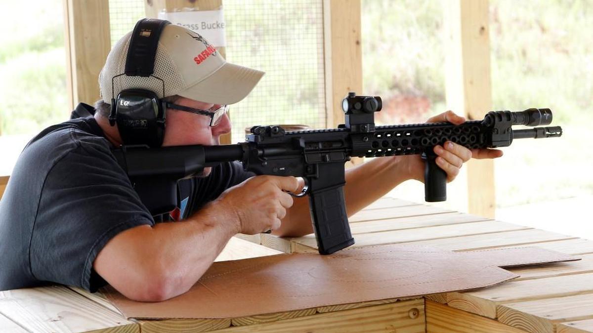 Shooting enthusiast Jamie Wells from Franklinton takes aim with his AR-15 rifle at the new shooting range at the Caswell Game Lands near Yanceyville in Caswell County on Sept. 11, 2014.
