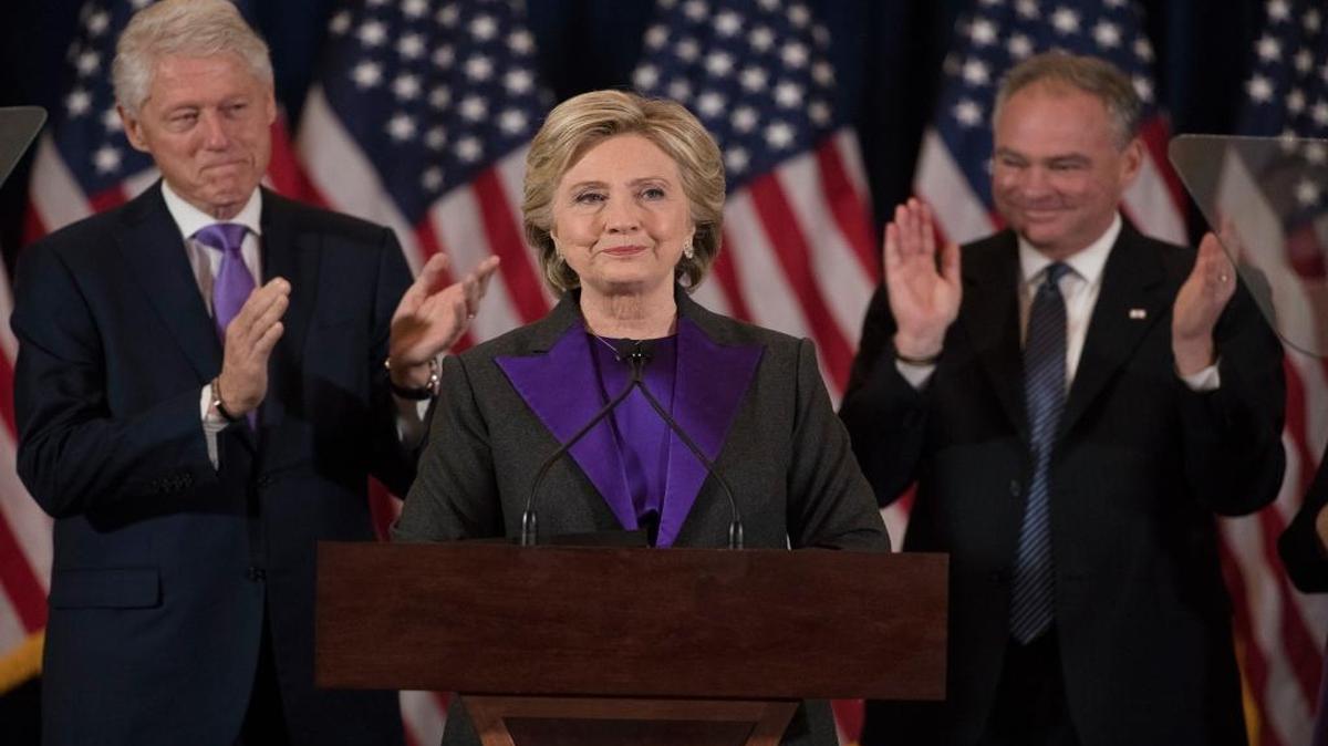 Former President Bill Clinton and Sen. Tim Kaine, D-Va. applaud as Democratic presidential candidate Hillary Clinton speaks in New York, Wednesday, Nov. 9, 2016, where she conceded her defeat to Republican Donald Trump after the hard-fought presidential election.
