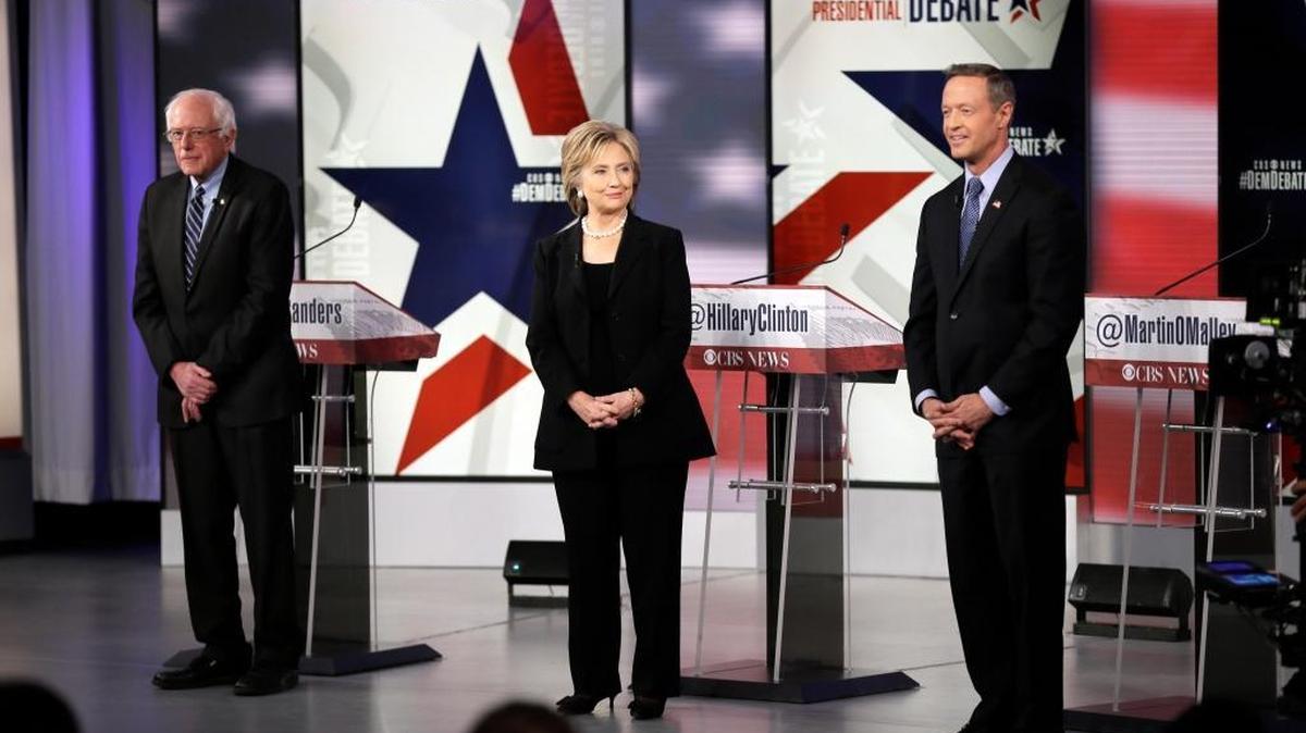 Democratic presidential candidates Bernie Sanders, left, Hillary Rodham Clinton and Martin O'Malley take the stage before a Democratic presidential primary debate, Saturday, Nov. 14, 2015, in Des Moines, Iowa.