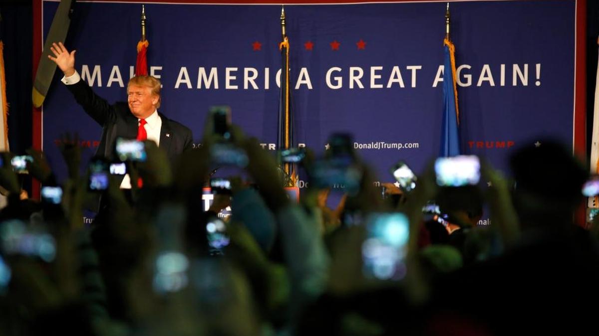 Republican presidential candidate, businessman Donald Trump, waves to supporters before his rally coinciding with Pearl Harbor Day at Patriots Point aboard the aircraft carrier USS Yorktown in Mt. Pleasant, S.C., Monday, Dec. 7, 2015.