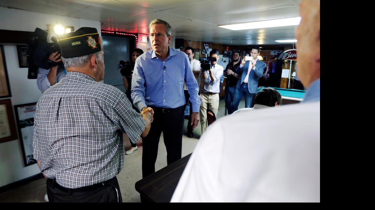 
Republican presidential candidate former Florida Gov. Jeb Bush is attracting Facebook traffic. Here he shakes hands with veterans during a campaign stop at VFW Post 3041 in Lancaster, N.H. Thursday.
