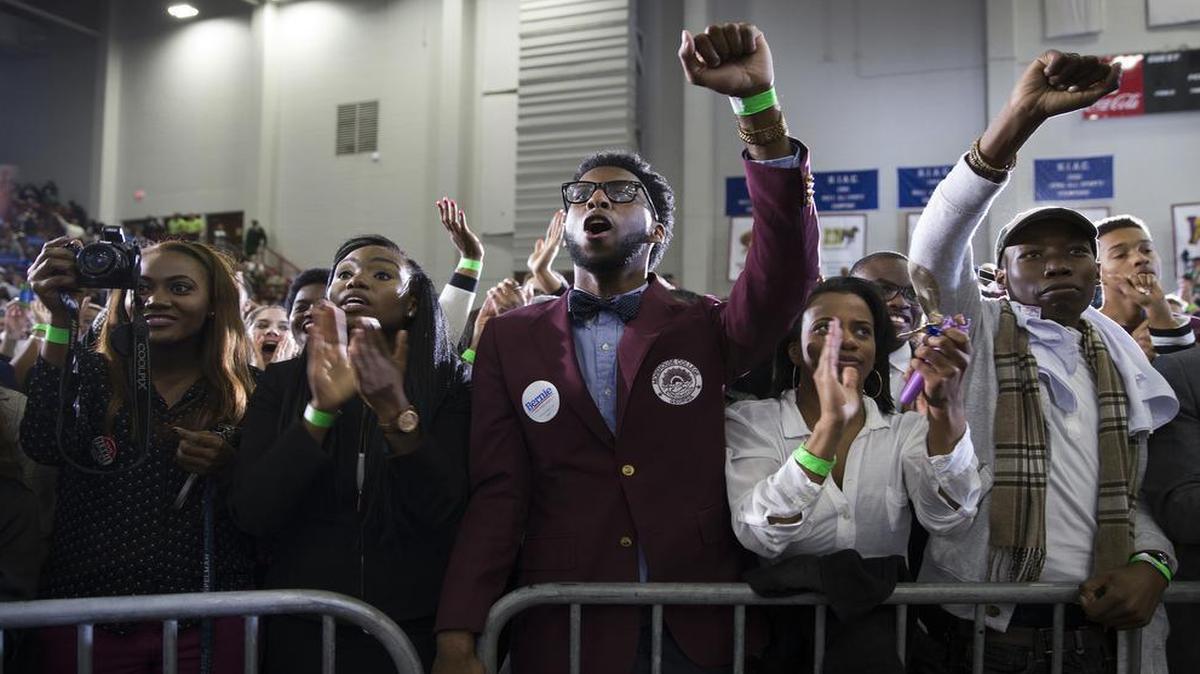 Ronald Comeaux, of Donaldsonville, La., cheers as Democratic presidential candidate Sen. Bernie Sanders, I-Vt., speaks during a rally at Morehouse College.