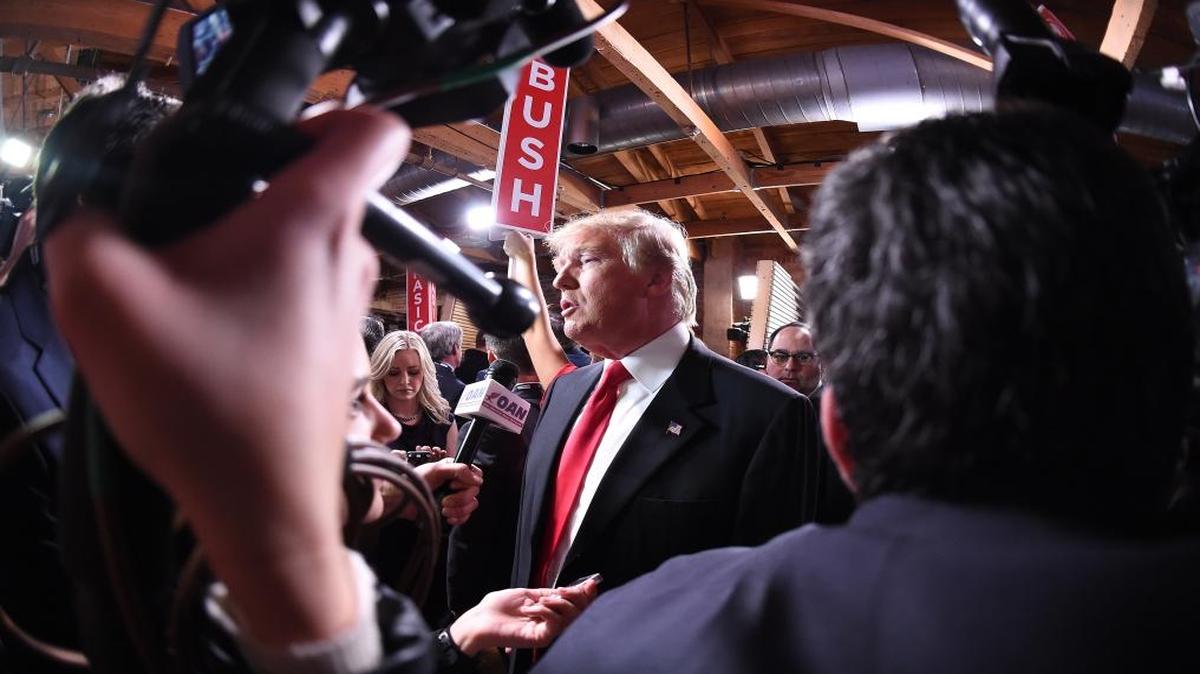 Republican presidential candidate, businessman Donald Trump speaks to the media in the spin room after the CBS News Republican presidential debate at the Peace Center Saturday night.