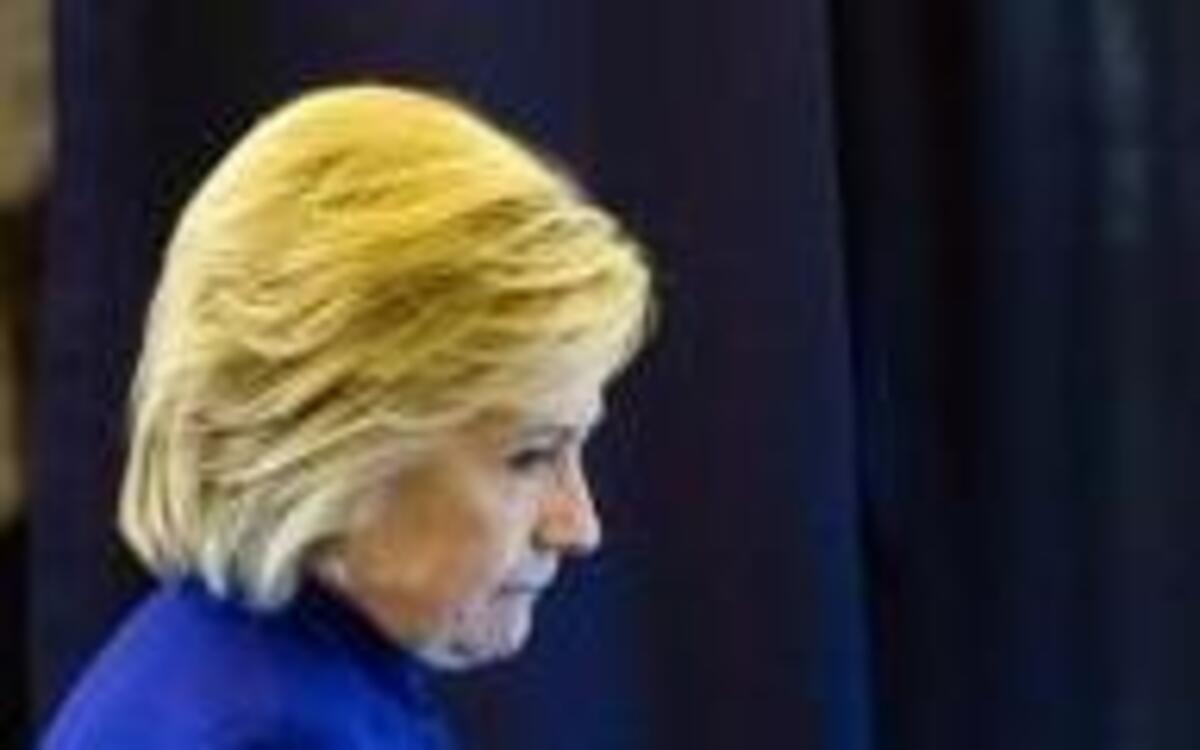 Democratic presidential candidate Hillary Clinton meets with members of her staff onboard her campaign plane en route to Westchester County Airport in White Plains, N.Y., from Florida, Wednesday, Sept. 21, 2016.