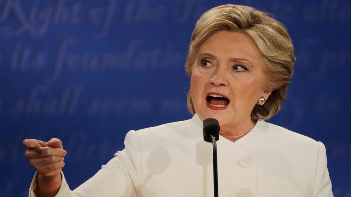 Democratic presidential nominee Hillary Clinton speaks to Republican presidential nominee Donald Trump during the third presidential debate at UNLV in Las Vegas, Wednesday, Oct. 19, 2016.