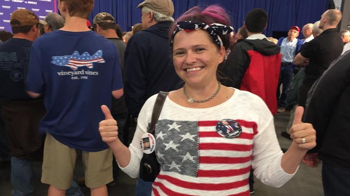 Kelly Hammer signals her support for Donald Trump at a Mike Pence rally in York, Pa., on Thursday, Sept. 29, 2016.