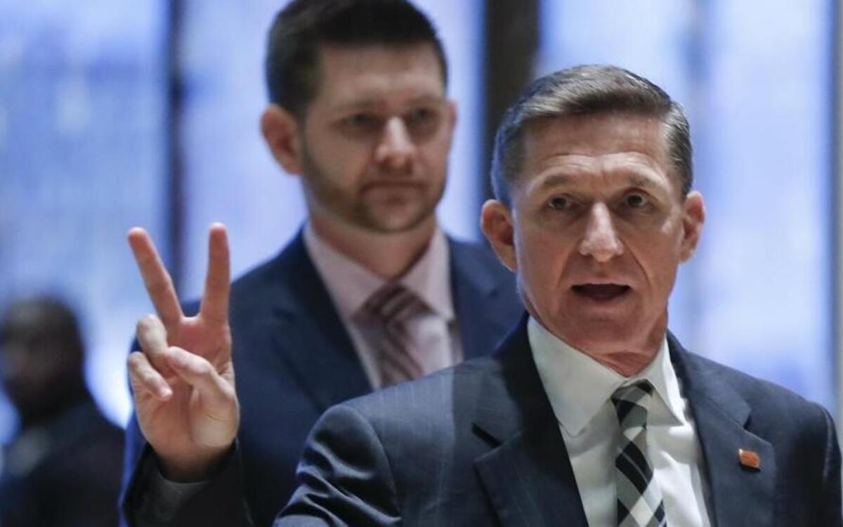 Retired Lt. Gen Michael Flynn gestures as he arrives at Trump Tower, Thursday, Nov. 17, 2016, in New York.