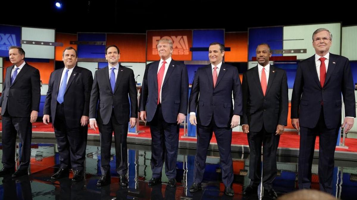 Ben Carson, seen here with his Republican presidential rivals, Tuesday suspended his campaign after an Iowa volunteer was killed in a car accident.