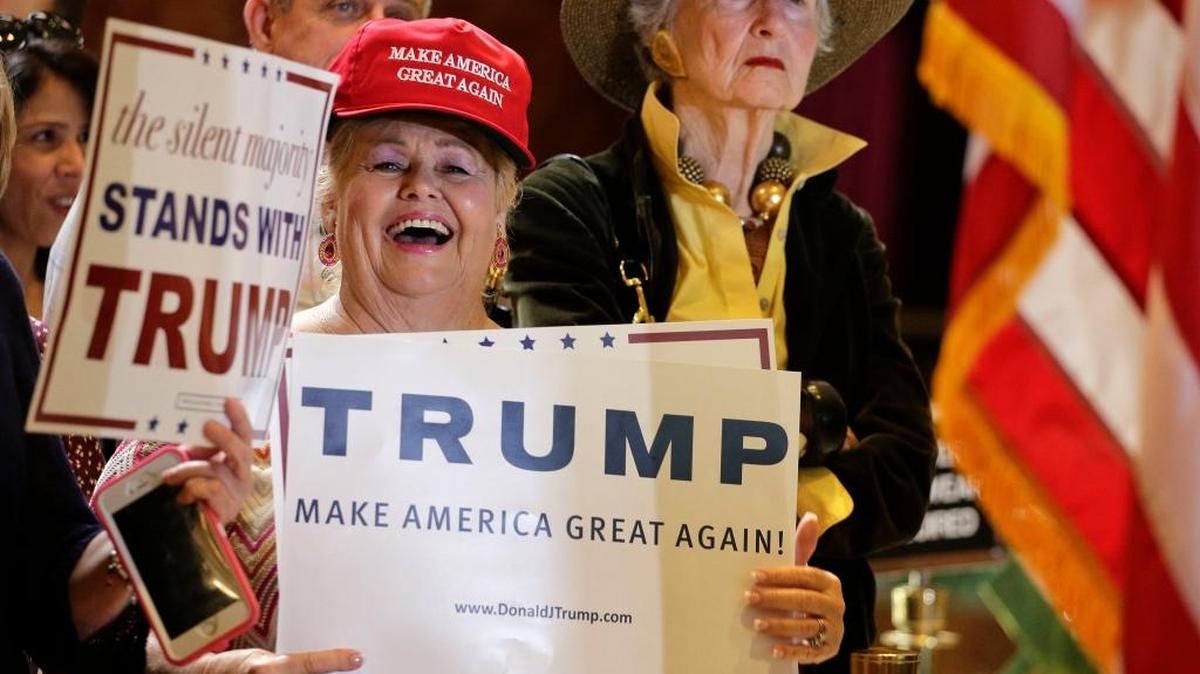 
A supporter for Republican presidential candidate Donald Trump reacts to a joke Trump made about Russian President Vladimir Putin being a nicer person than him during a news conference, Monday, Sept. 28, 2015, in New York.
