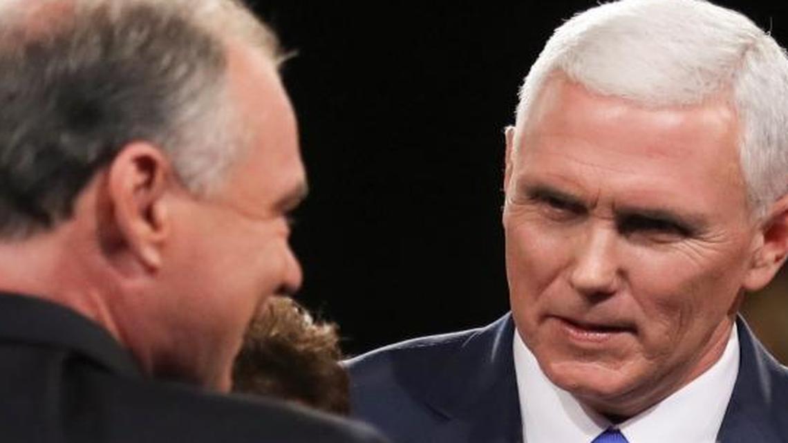 Democratic vice-presidential nominee Sen. Tim Kaine flashes a thumbs up and Republican vice-presidential nominee Gov. Mike Pence looks on after the vice-presidential debate at Longwood University in Farmville, Va., Tuesday, Oct. 4, 2016.