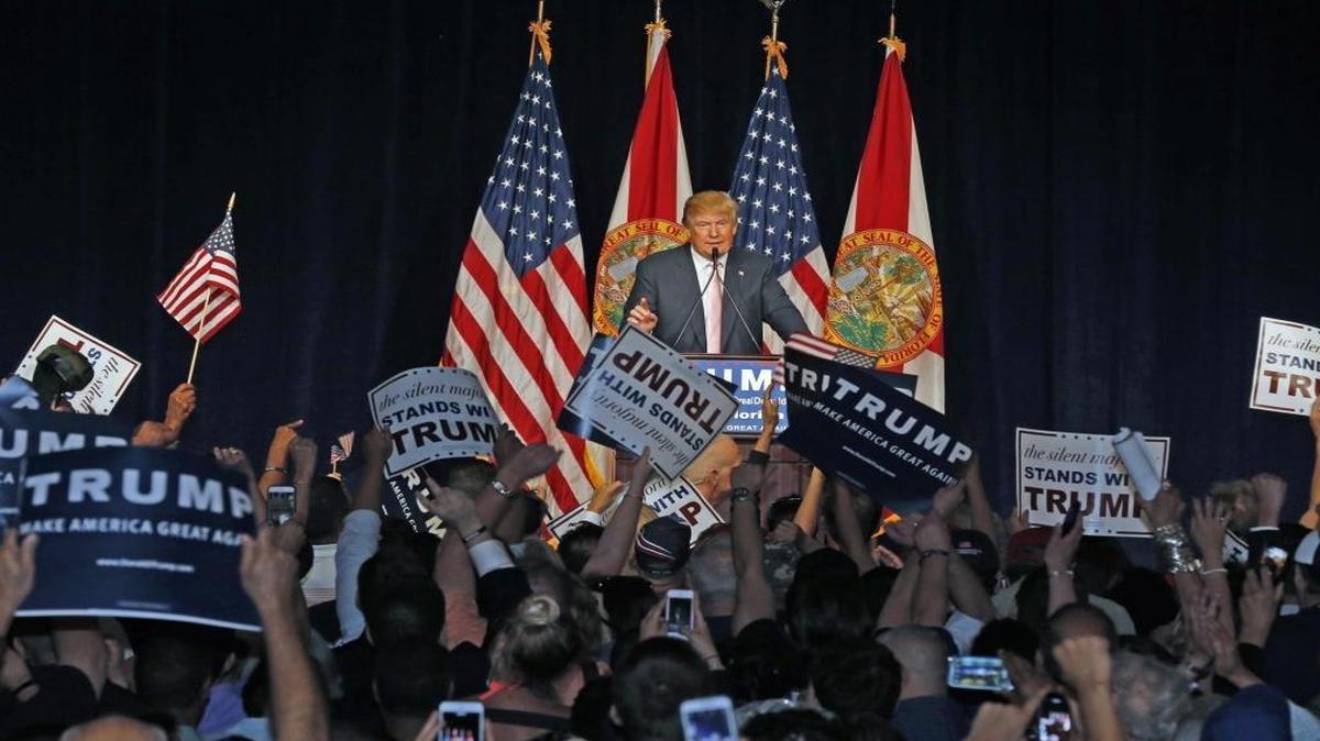 Fans cheer Donald Trump at a rally last October at the Trump National Doral resort outside Miami.