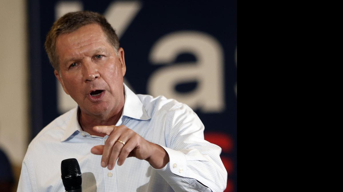
Ohio Gov. John Kasich speaks at a town hall style meeting in Nashua, N.H. Kasich is fighting for a spot in next week’s Republican presidential debate.
