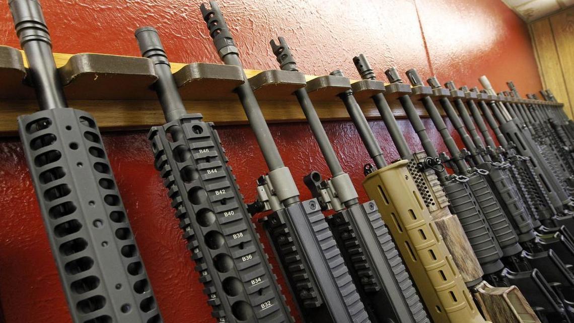 In this July 20, 2012, file photo, a row of different AR-15 style rifles are displayed for sale at the Firing-Line indoor range and gun shop in Aurora, Colo. A new McClatchy-Marist poll finds that voters are more fearful of being victims of gun violence than an act of terrorism.