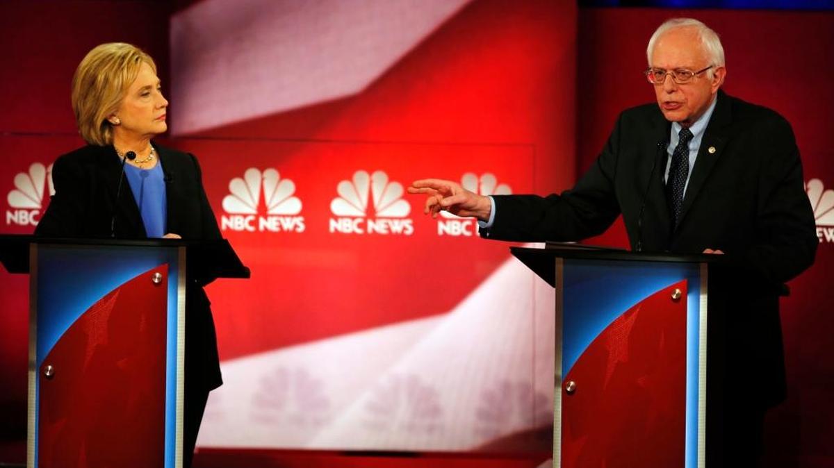 Democratic presidential candidate Bernie Sanders gestures towards Democratic rival Hillary Clinton during Sunday’s NBC, YouTube Democratic presidential debate.