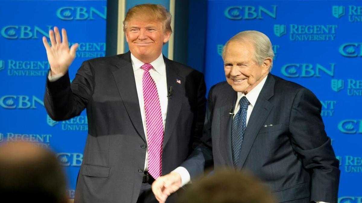 Republican presidential candidate, Donald Trump, accompanied by Rev. Pat Robertson, waves as he arrives for an appearance at Regent University in Virginia Beach, Va., Wednesday, Feb. 24, 2016.