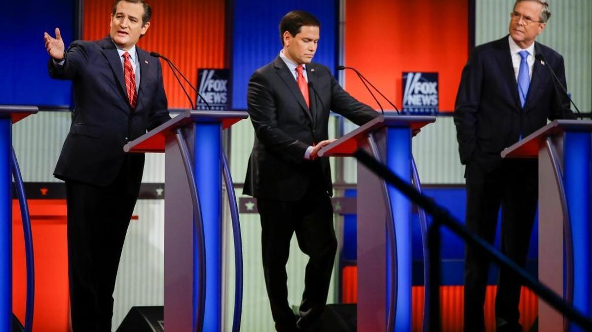 Sen. Ted Cruz, R-Texas (from left), answers a question as Sen. Marco Rubio, R-Fla., listens and former Florida Gov. Jeb Bush looks on during a Republican presidential primary debate, Thursday, Jan. 28, 2016, in Des Moines, Iowa.