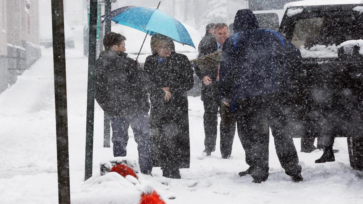 Democratic presidential candidate Hillary Clinton arrives in the falling snow for a campaign stop Friday in Manchester, N.H.