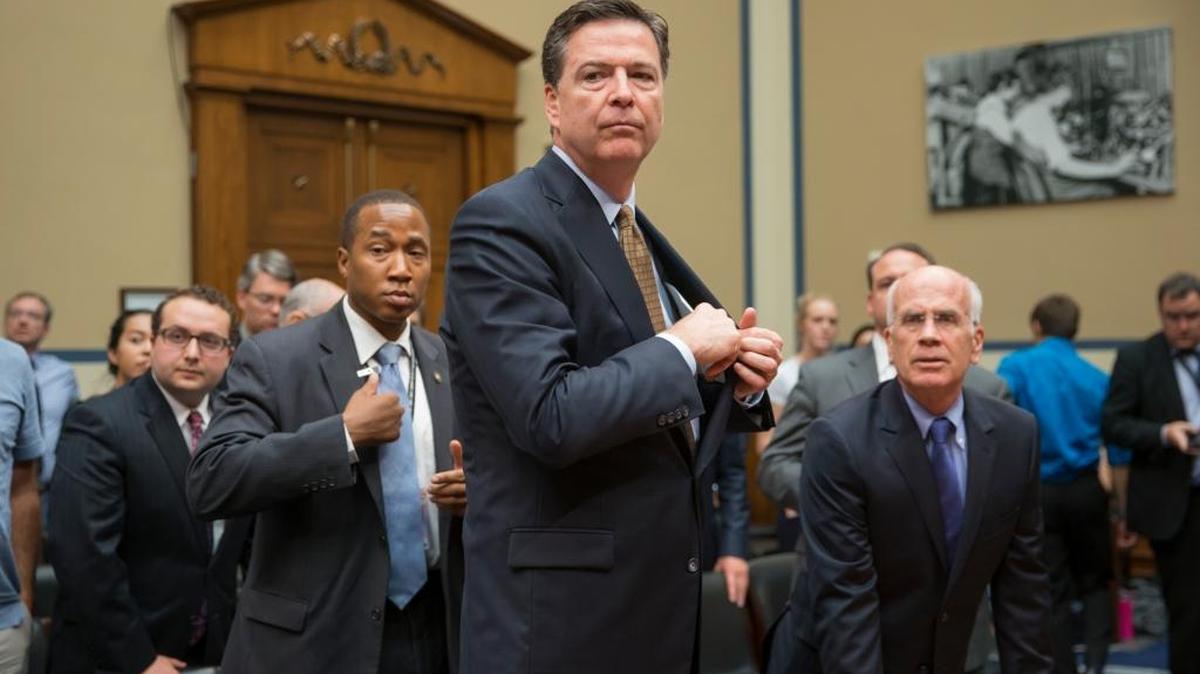 FBI Director James Comey concludes his appearance before the House Oversight and Government Reform Committee, on Capitol Hill in Washington, Thursday, July 7, 2016, to explain his agency's recommendation to not prosecute Democratic presidential candidate Hillary Clinton over her private email setup during her time as secretary of state. At right is committee member Rep. Peter Welch, D-Vt.