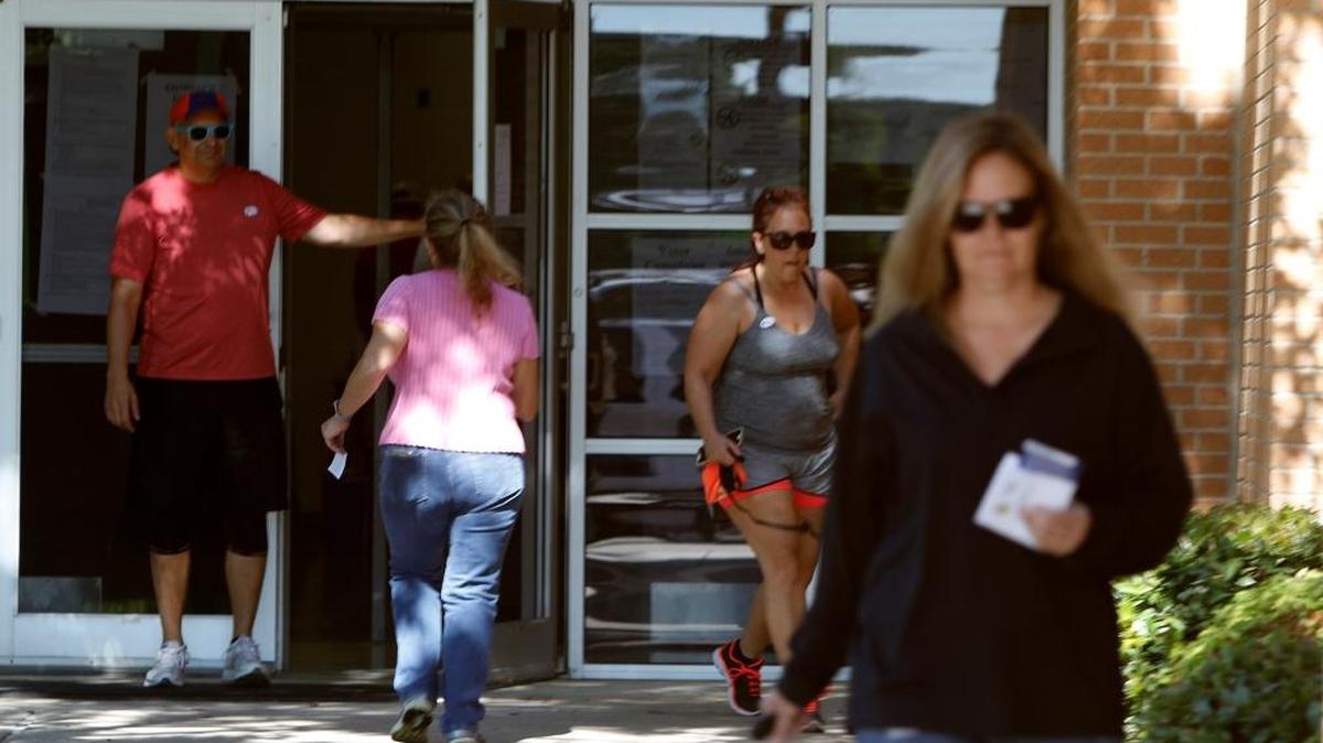 Keller voters leave and arrive at their respective polling place during local elections at Bear Creek Intermediate School Saturday in a spring election.